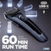 A black Status USB-C rechargeable cordless hair clipper with guide comb, shown on a dark gray reflective background with glowing crystal-like blocks and promotional text reading '60 MIN RUN TIME' and 'USB-C RECHARGING'.