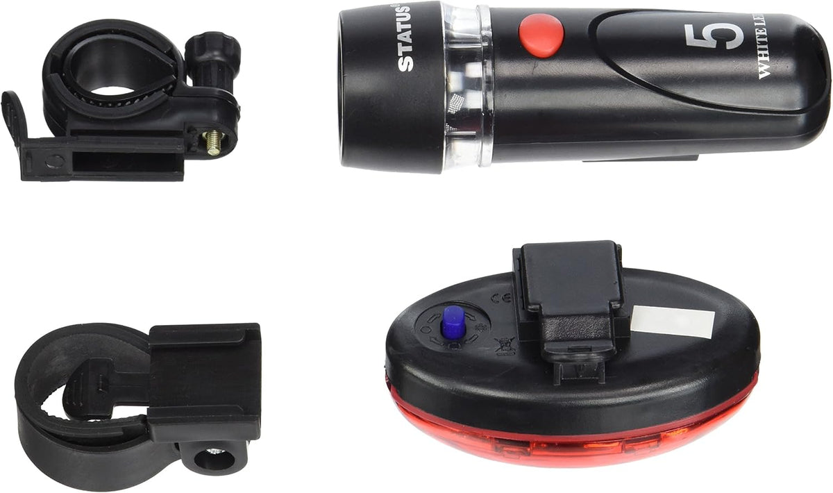 A bicycle light kit shown on a white background, including a black cylindrical light with a red button and white text, a black ring clamp, a black clip-on mount, and a black oval reflector with a red rear panel and blue button.