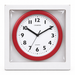 Packaging mockup of Champion red wall clock with white face, visible through clear plastic in a plain white box