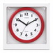 Packaging mockup of Champion red wall clock with white face, visible through clear plastic in a plain white box